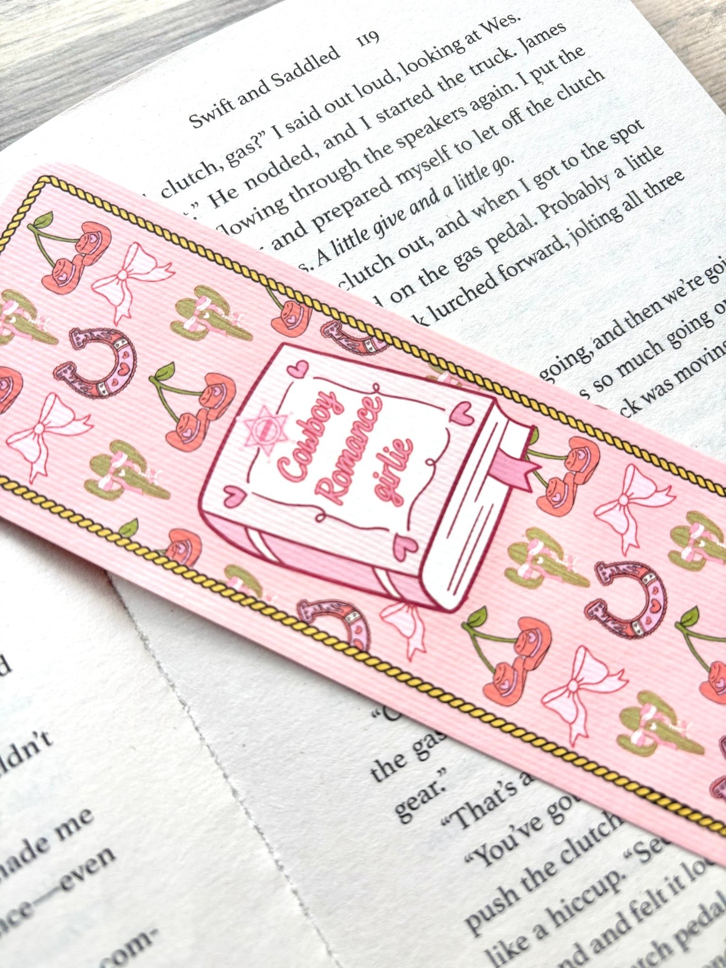 Cowboy Romance Girlie Bookmark marking a page