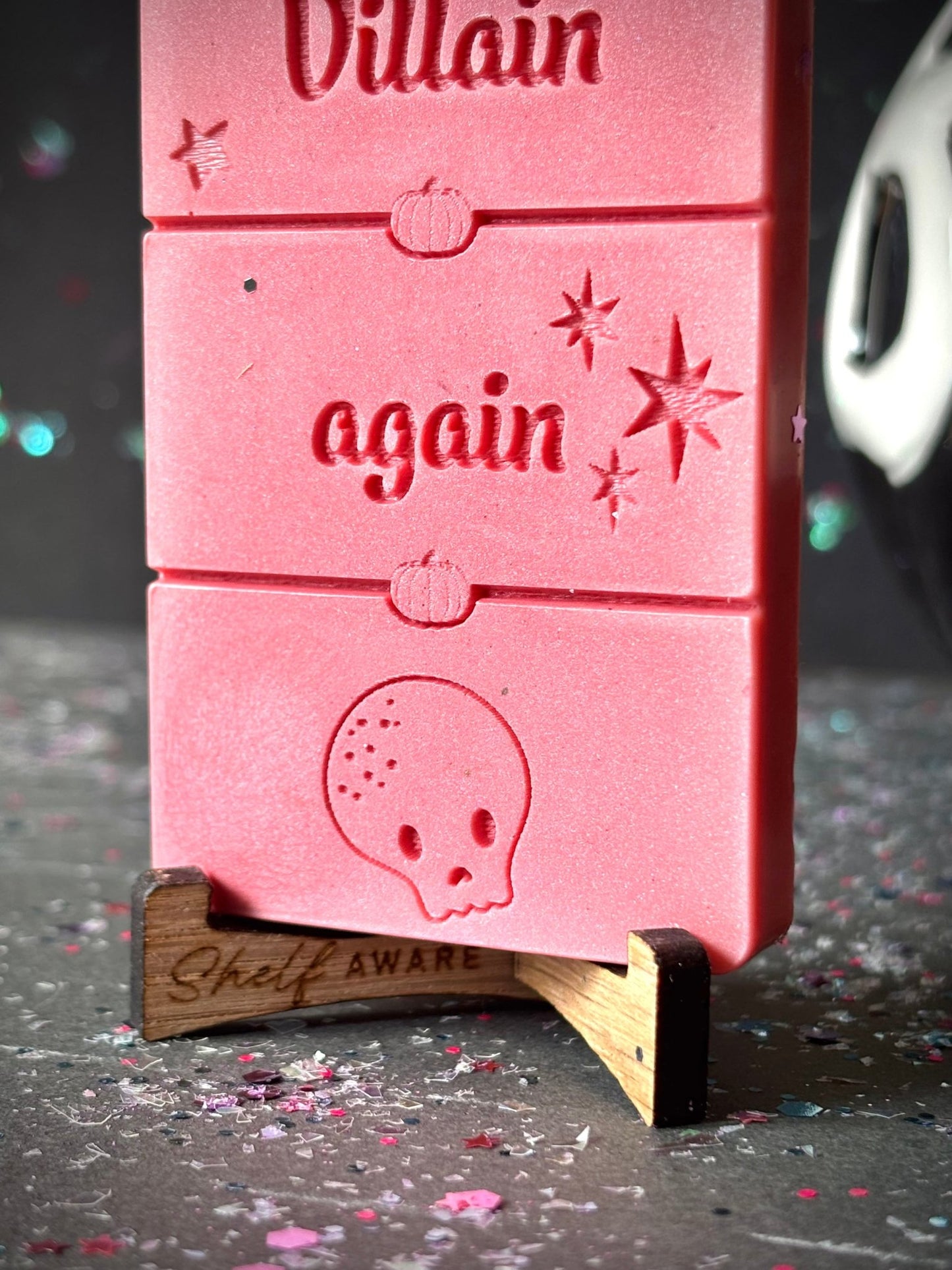 I Fell For The Villain Again wax melt for book lovers zoomed in on a display stand