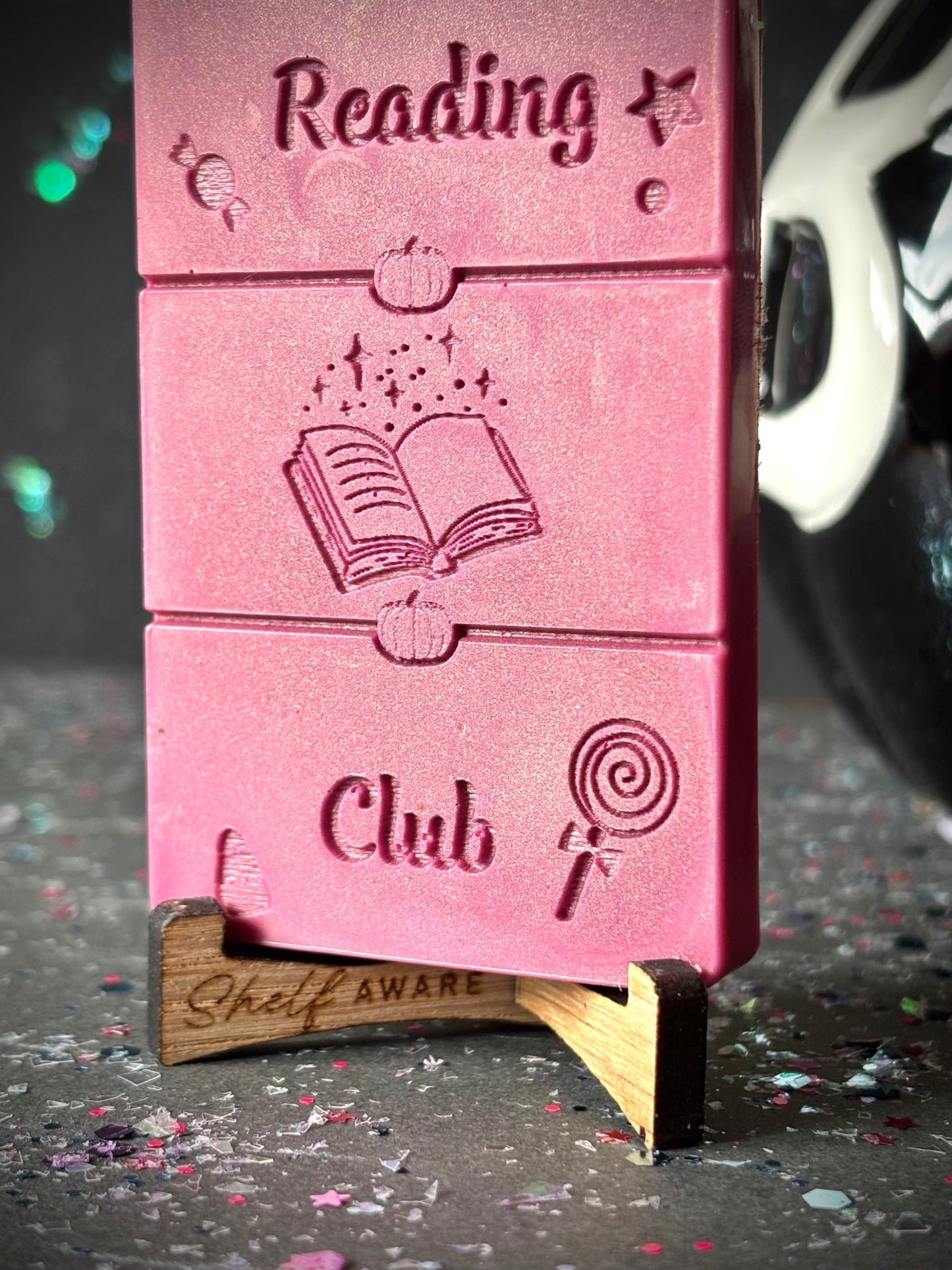 Midnight Reading Club book lover wax melt bar zoomed in on stand
