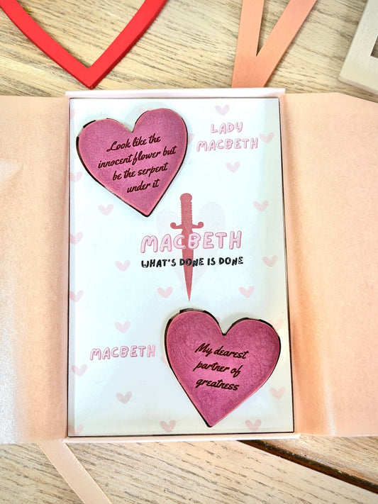 macbeth wax melts for book lovers in a pink gift box. two wax melts with quotes on them from macbeth and lady macbeth. gifts for classic book lovers and shakespeare. look like the  innocent flower but be the serpent under it quote on a wax melt.
