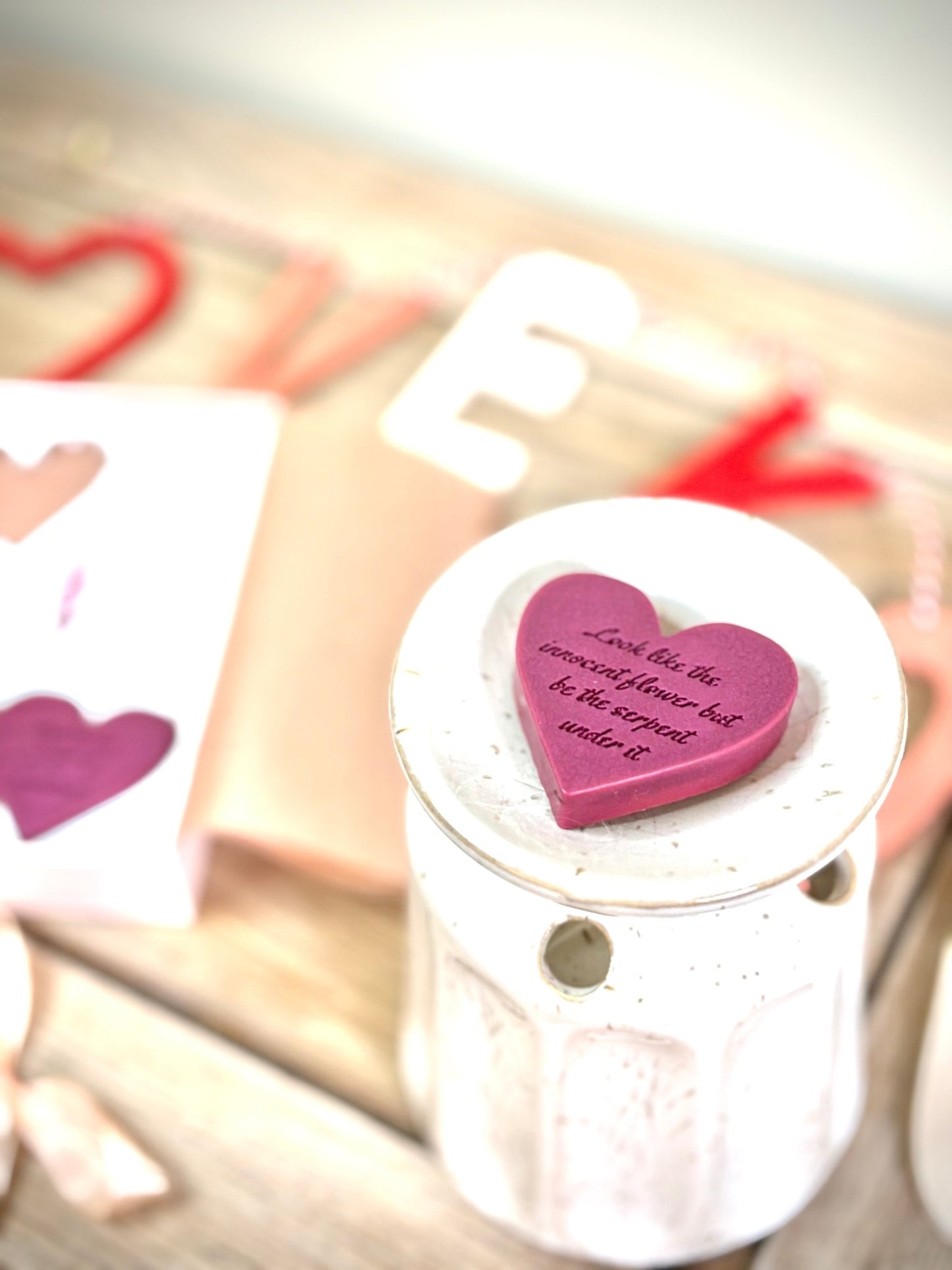 macbeth wax melts for book lovers in a pink gift box. two wax melts with quotes on them from macbeth and lady macbeth. gifts for classic book lovers and shakespeare. look like the innocent flower but be the serpent under it quote on a wax melt.