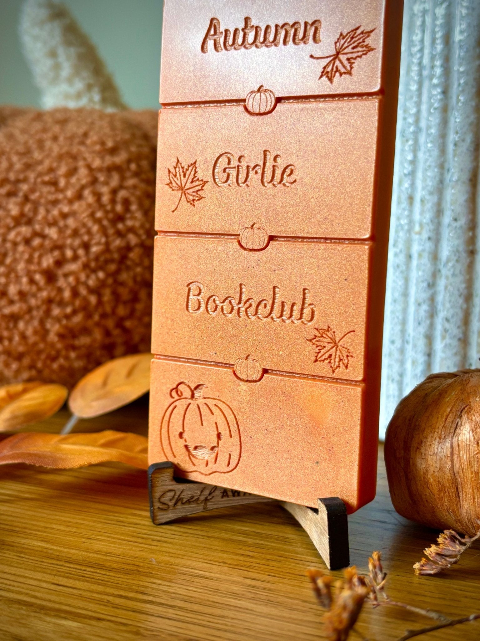 autumn book lover wax melt on a display stand for book gifts