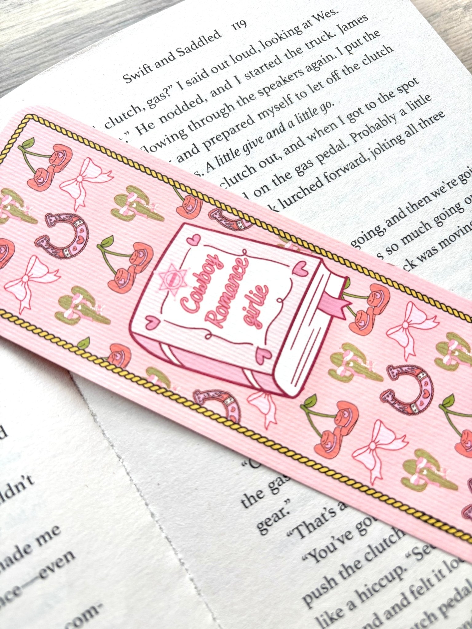 Cowboy Romance Girlie Bookmark marking a page