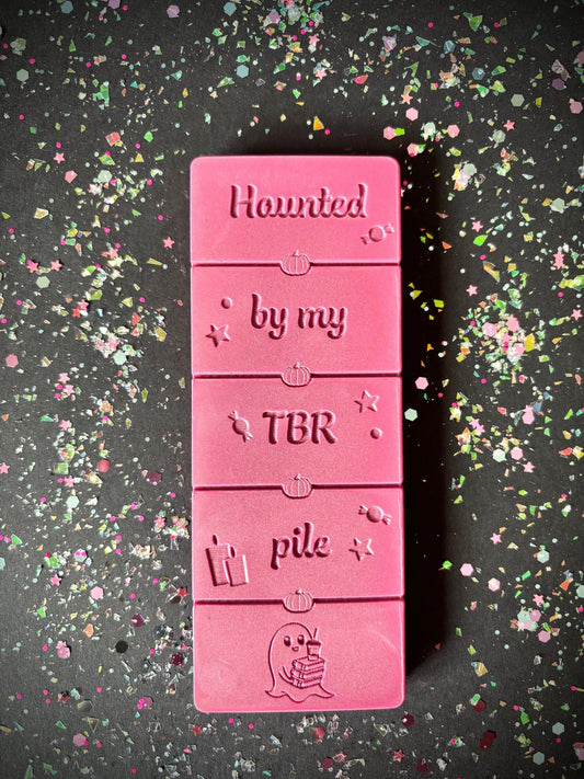 Haunted By My TBR Pile book gift flatlay