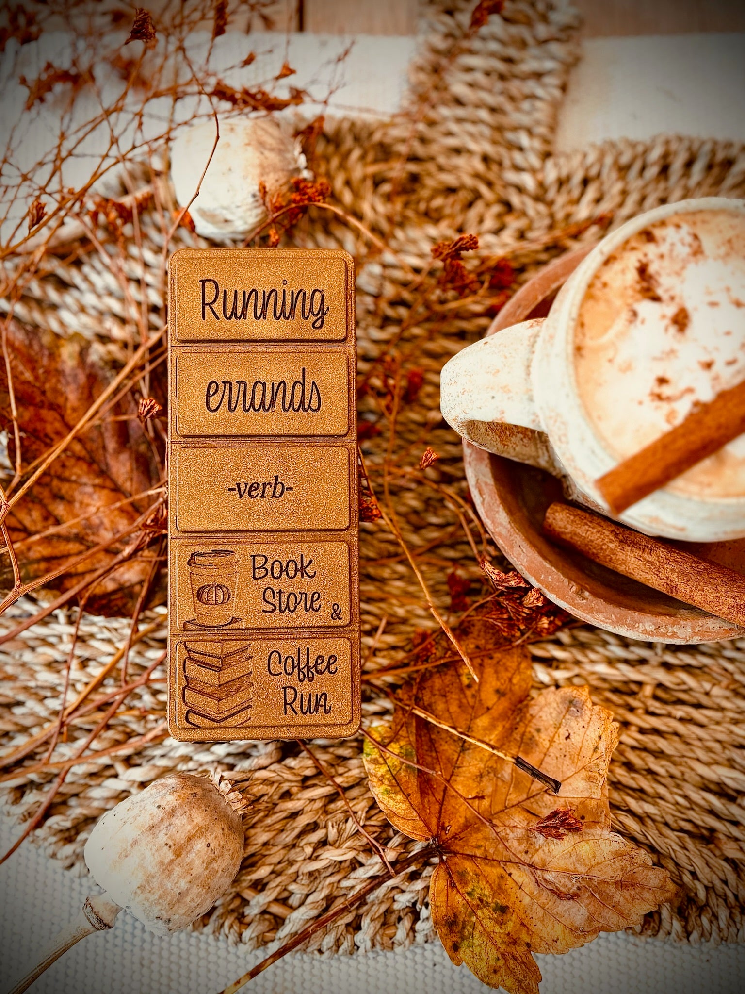 Book store and coffee bronzed wax melt bar with an autumnal tablescape with coffee.